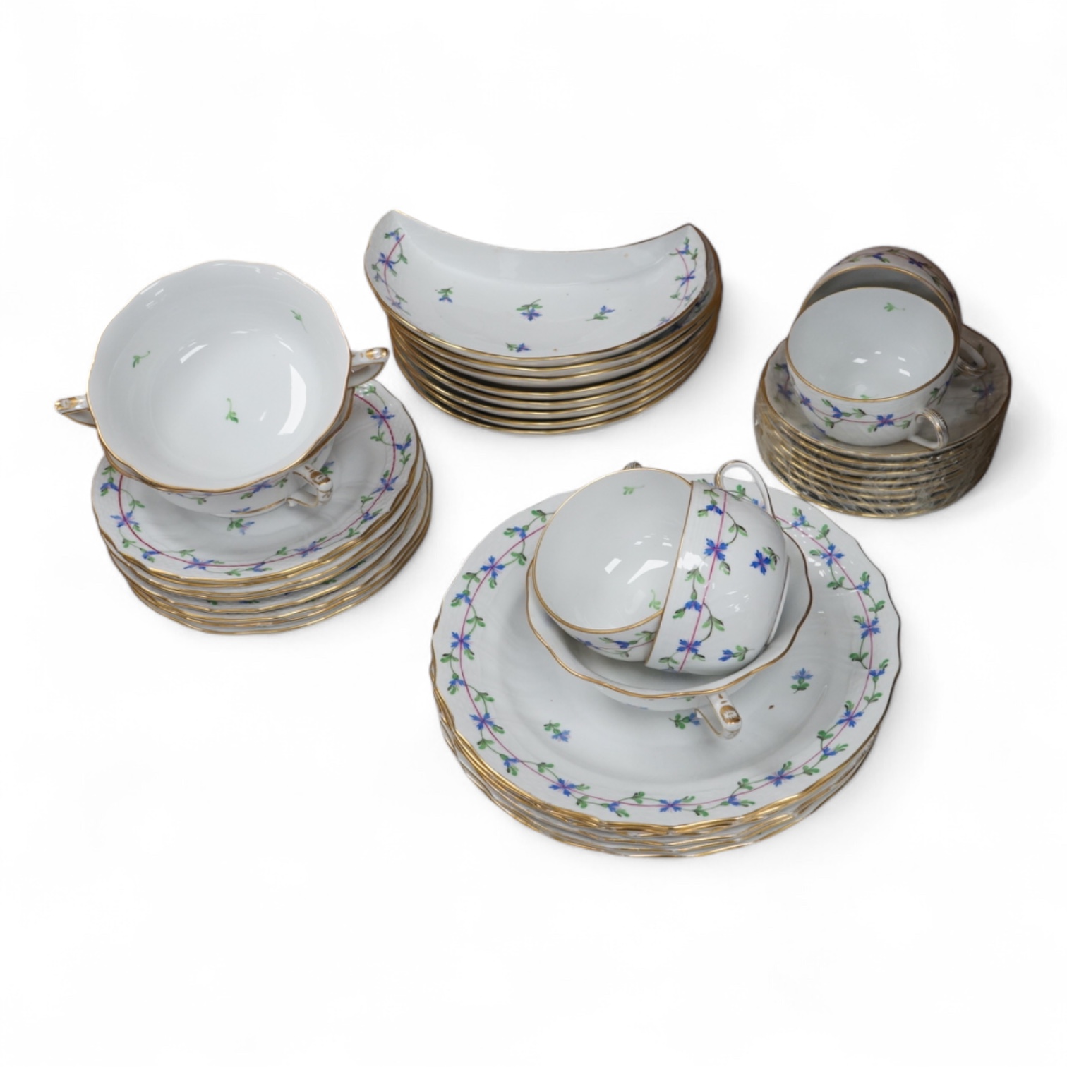 A Herend blue garland part tea set to include plates, twin handles cups and crescent dishes, largest 23cm in diameter